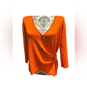Beautiful wrap top in a striking tangerine color.